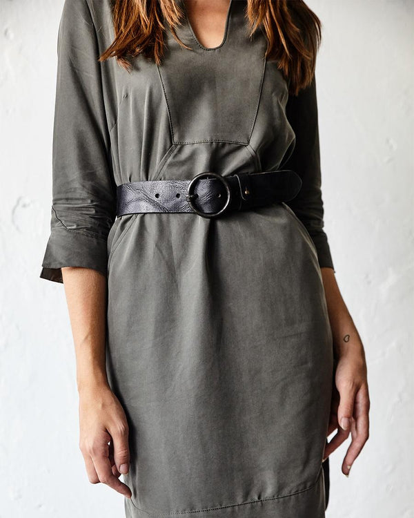 Black Pip belt over a grey dress