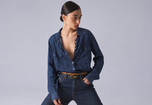 Woman in denim shirt wearing two Amsterdam Heritage leather belts