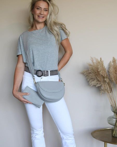 Grey Pip belt with a grey tee and white jeans, grey crossbody bag