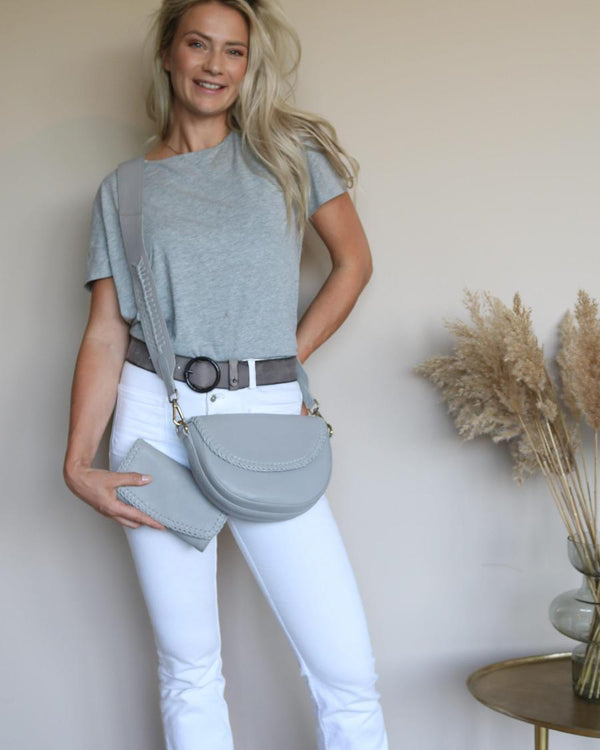 Grey Pip belt with a grey tee and white jeans, grey crossbody bag