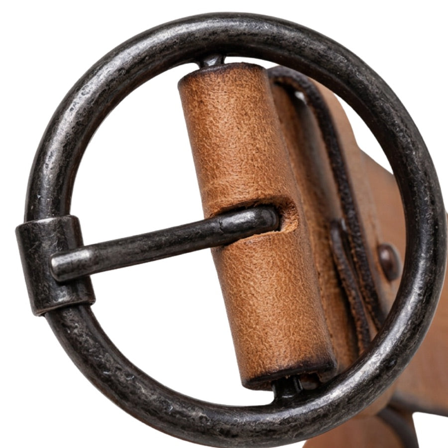 Close-up of the Pip's round buckle with the leather strap folded around the bar
